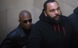 Dieudonné M'Bala M'Bala à son arrivée au tribunal de Paris, le 13 décembre 2013. (Crédit : Joel Saget/AFP)